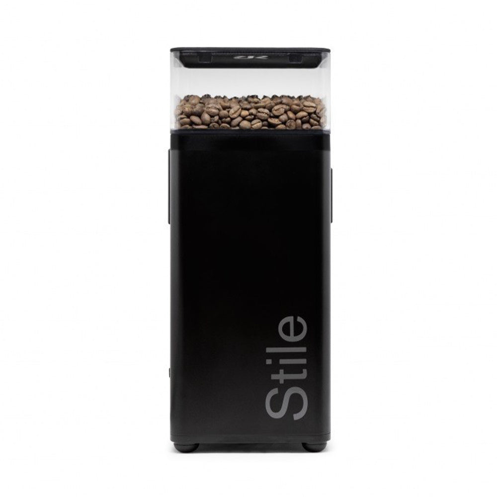 Black coffee grinder with 'Stile' branding and coffee beans on a white background