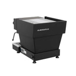 A La Marzocco Linea Mini espresso machine with a white body, black accents, and a stainless steel top.