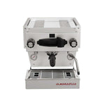 A La Marzocco Linea Mini espresso machine with a white body, black accents, and a stainless steel top.