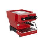 A La Marzocco Linea Mini espresso machine with a white body, black accents, and a stainless steel top.
